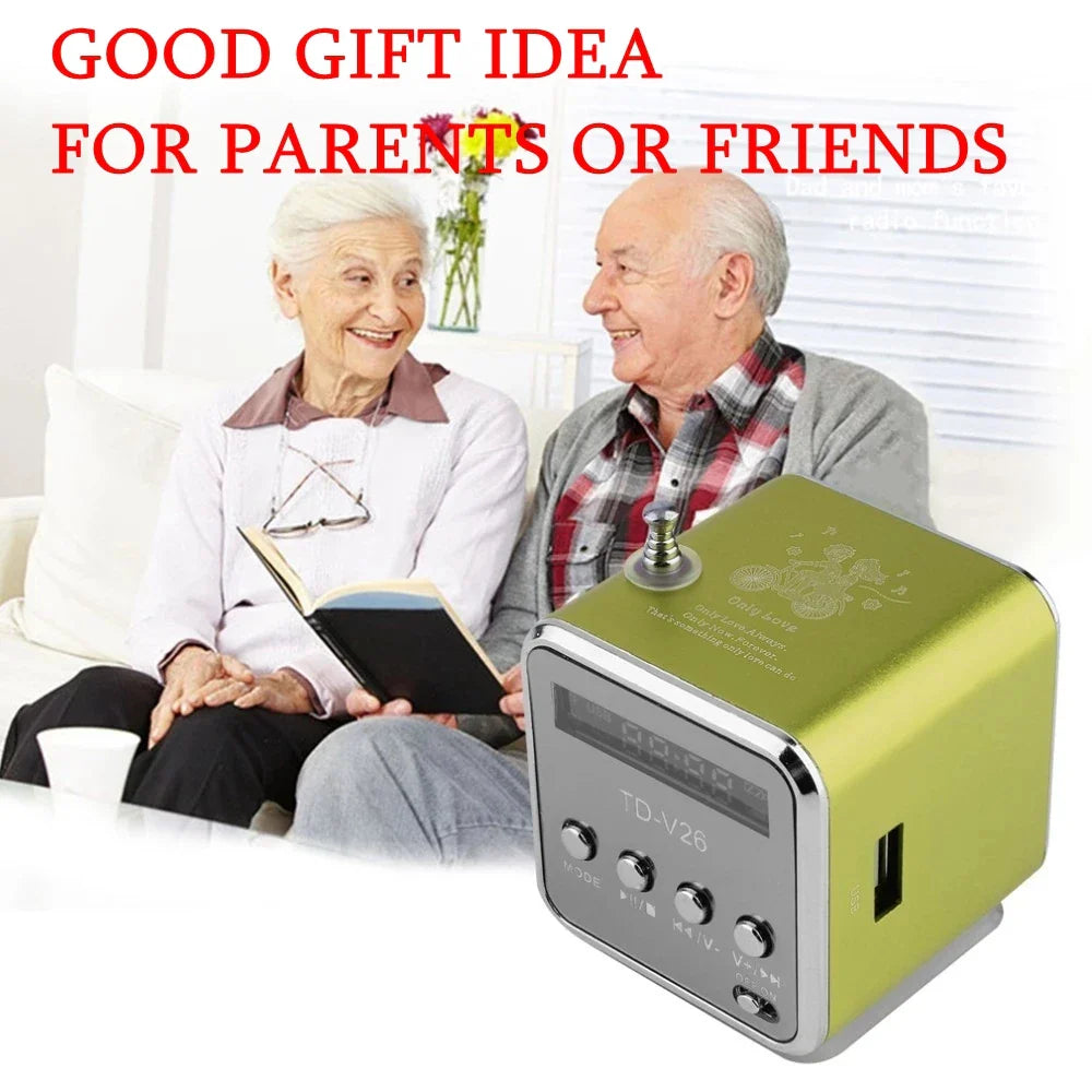 A lime green and silver td-v26 mini portable bluetooth speaker with aluminum alloy body, digital clock, tf card, and usb port
