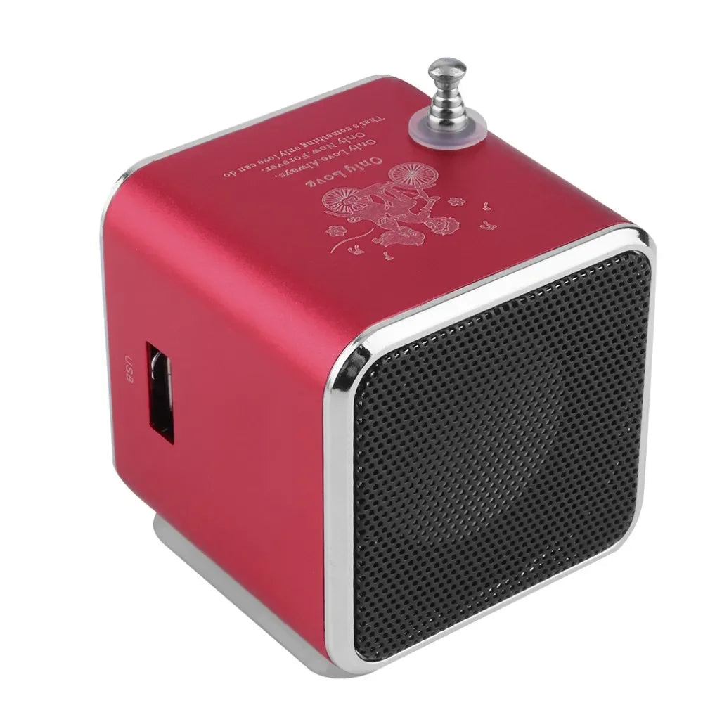 Red cube-shaped td-v26 mini portable bluetooth speaker with aluminum alloy trim, usb port, and engraved bicycle design