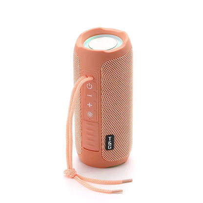 A peach-colored t&g tg227 wireless compatible speaker with mesh grille, power controls, carrying strap, and lamp outdoor portable design for radio music party