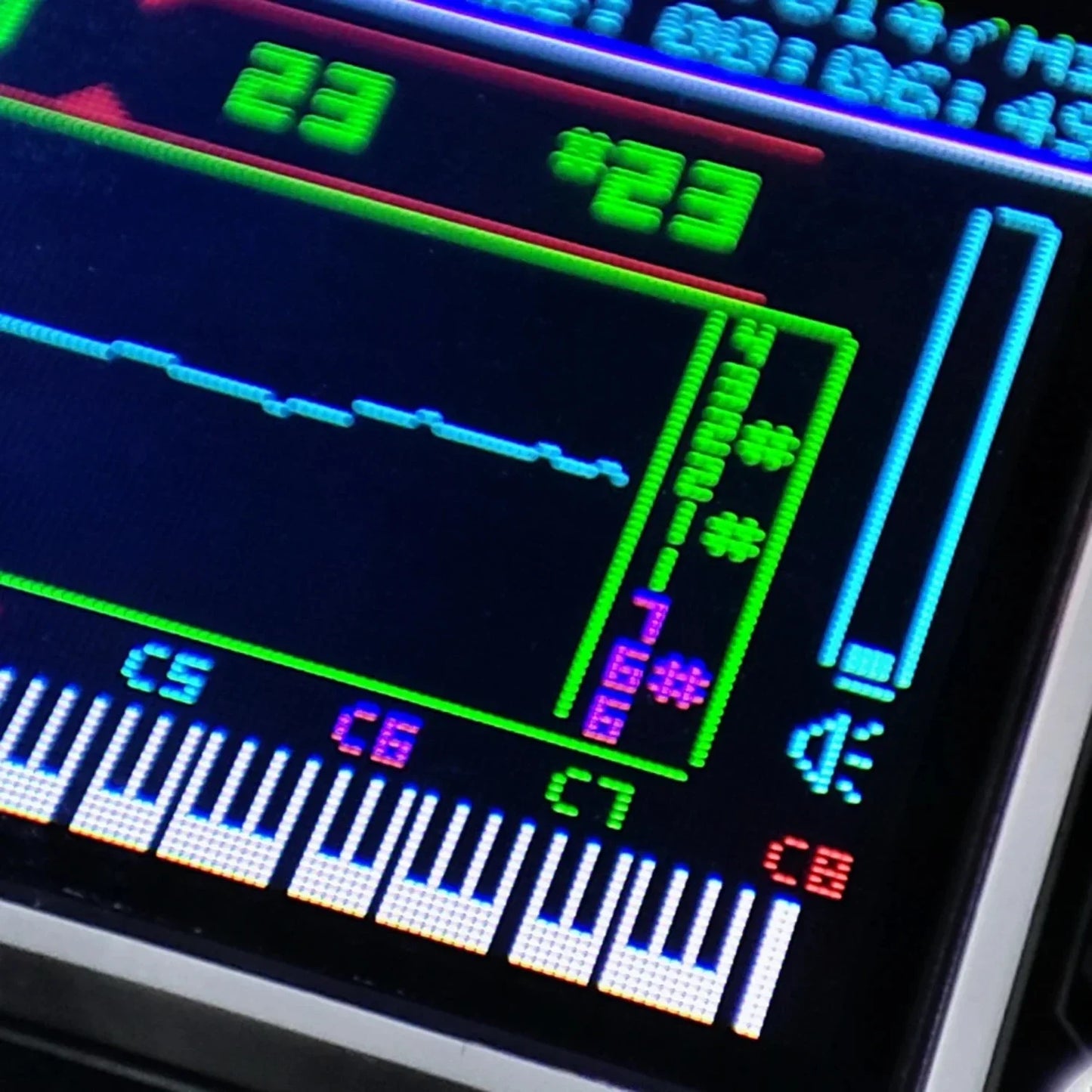 Digital display on theremin toy musical instrument with color screen waveform showing traditional chinese instruments