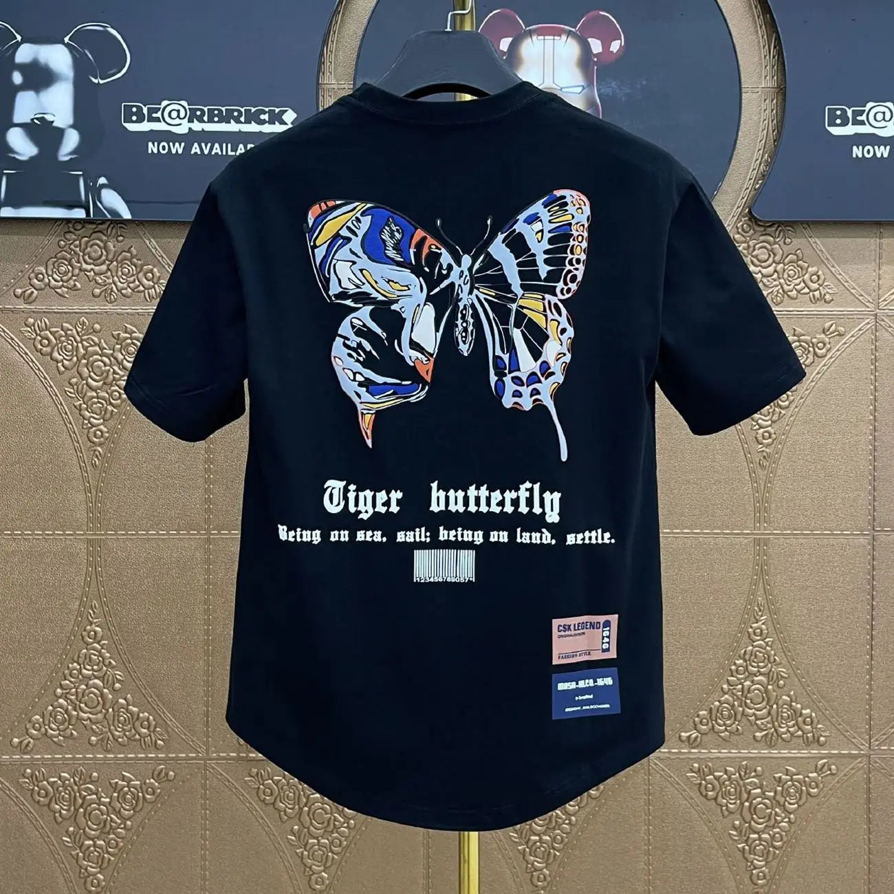 Black short-sleeved graphic hip hop t-shirt with vibrant tiger butterfly print and text for heather male tees Korean clothing