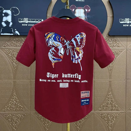 Back view of a maroon graphic hip hop short-sleeved t-shirt with a colorful tiger butterfly print korean clothing design