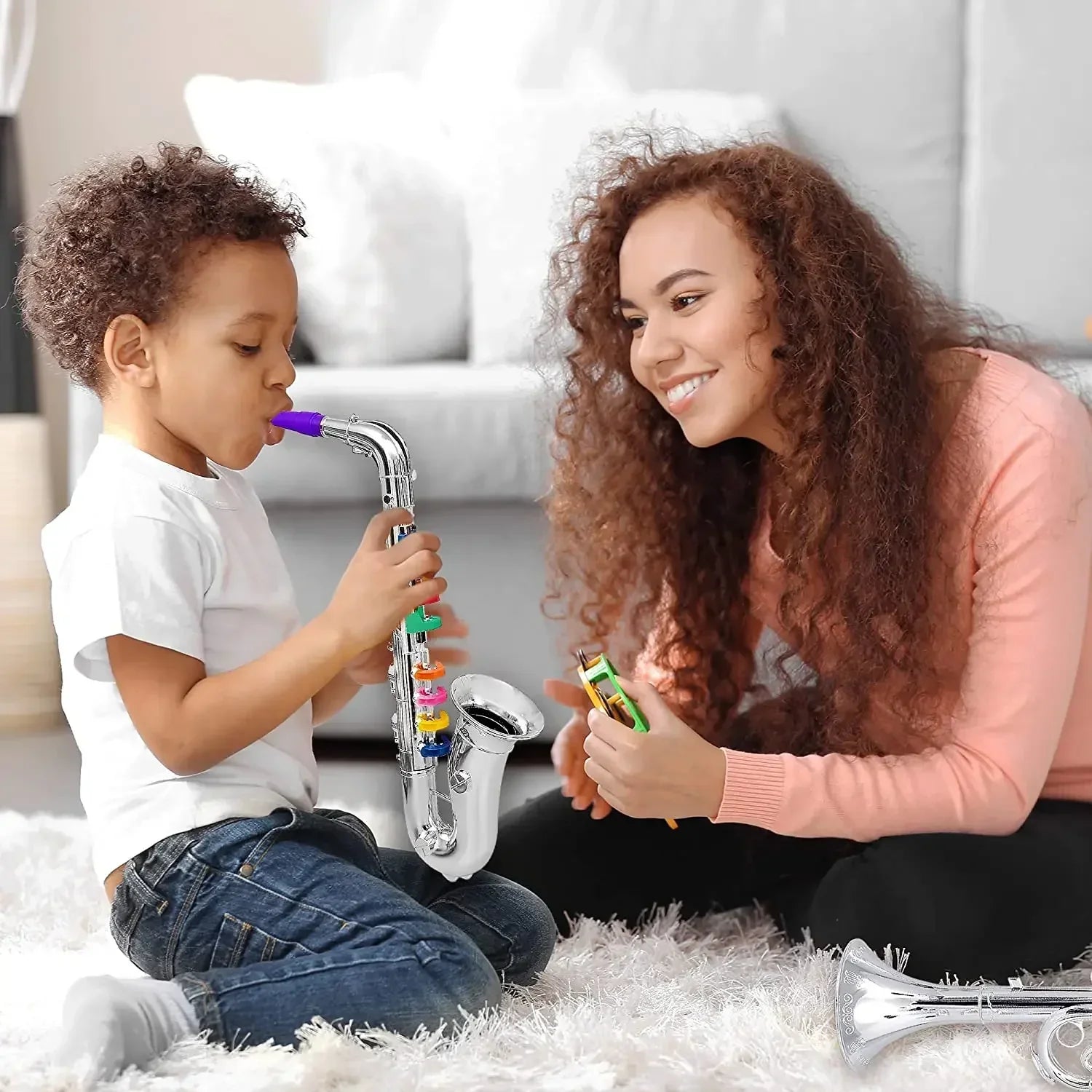 Toy clarinet for kids with shiny silver body purple mouthpiece and 8 rainbow coded keys teaching songs for toddlers