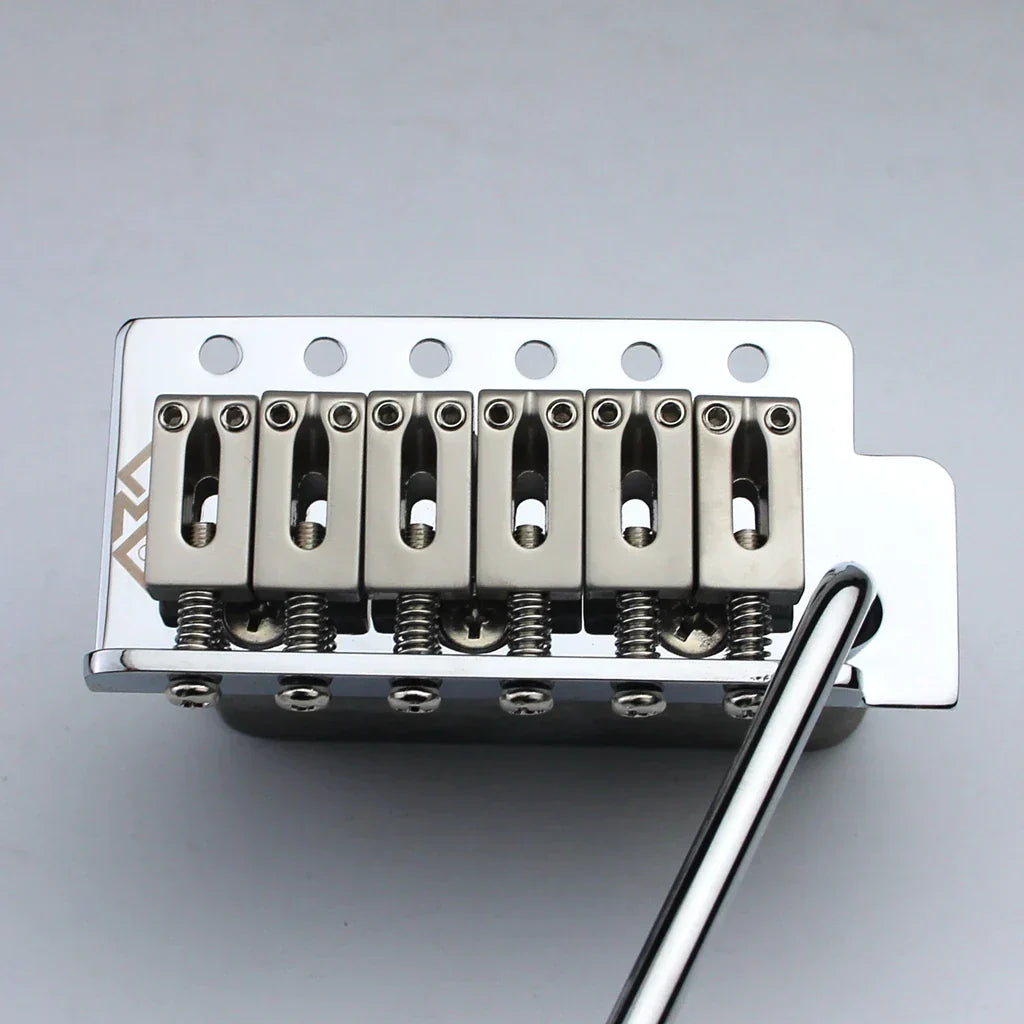 Chrome finished six-saddle tremolo bridge for stratocaster st electric guitar with polished metal body and visible springs