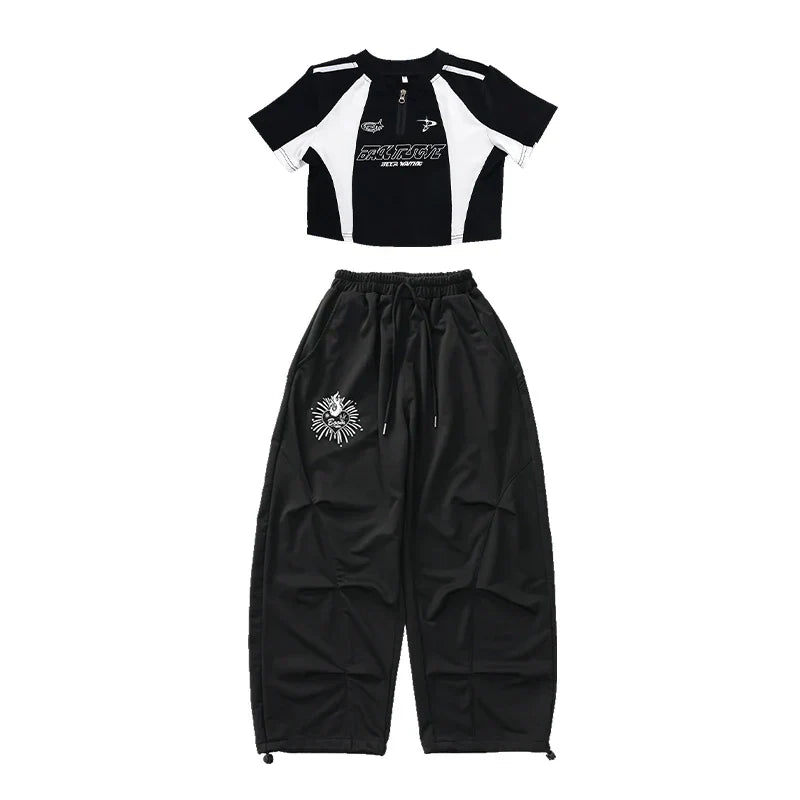 Black and white cropped top with bold graphic print and black drawstring pants with skull emblem for teenage child hiphop costume