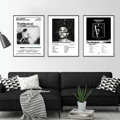 Three framed black and white trilogy the weeknd album wall art posters mounted above a dark sofa for home decor