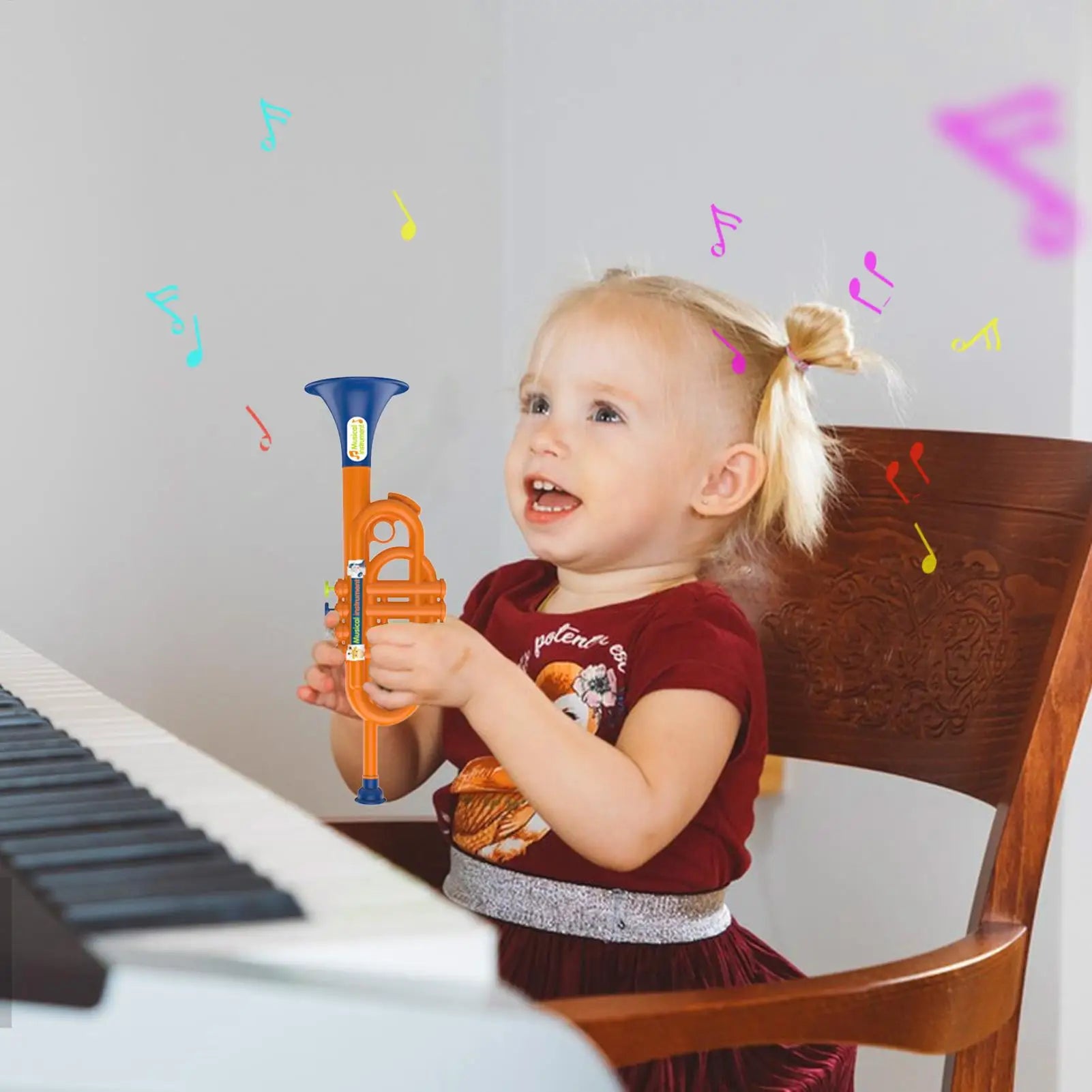 Orange plastic trumpet toy with blue mouthpiece and valves for kids boys educational early childhood musical use