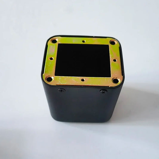 Black rectangular tube amplifier case with gold metallic base transformer cover and isolation shrouds secured by screws