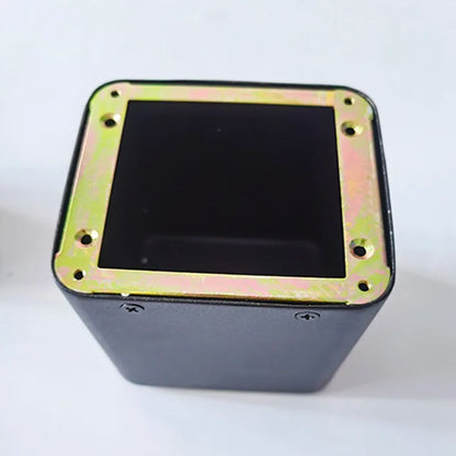 Black rectangular tube amplifier case with gold metal base transformer cover and isolation shrouds secured by four screws