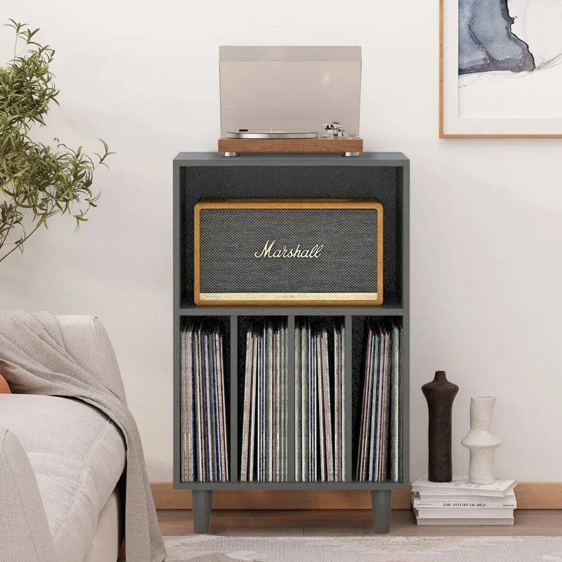 Dark gray marshall speaker with textured grille and gold trim in wooden media console turntable stand for music lover decor