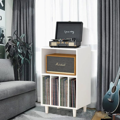 White wooden media console turntable stand with open cube shelves holding vinyl records and marshall speaker for music lover decor