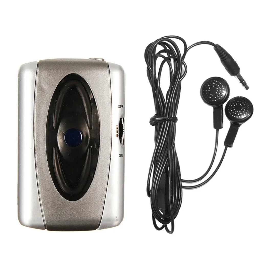 Silver portable cassette player with black earphones as amplifier device megaphone for voice microphone theater plays church