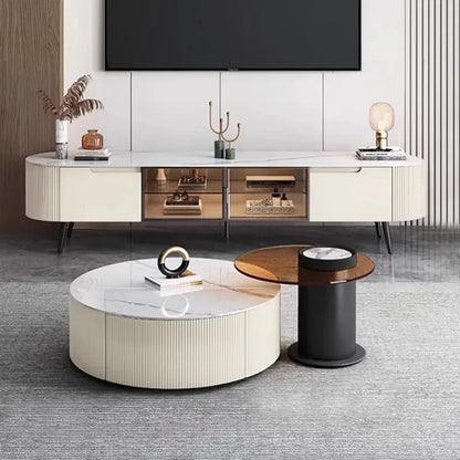 Cream-colored round coffee table with marble top and vertical ribbed sides for storage decor glamour and cabinet display decorations