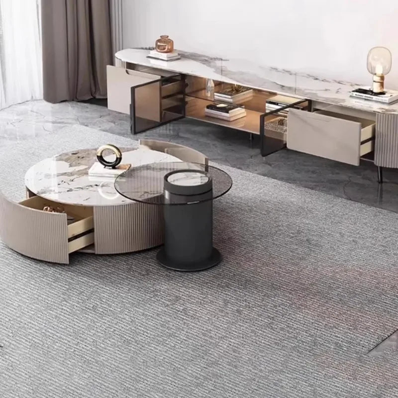 Modern round coffee table with marble top and beige ribbed sides featuring an open drawer for storage decor glamour