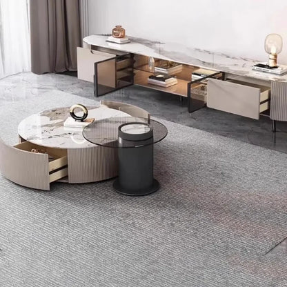 Modern round coffee table with marble top and beige ribbed sides featuring an open drawer for storage decor glamour