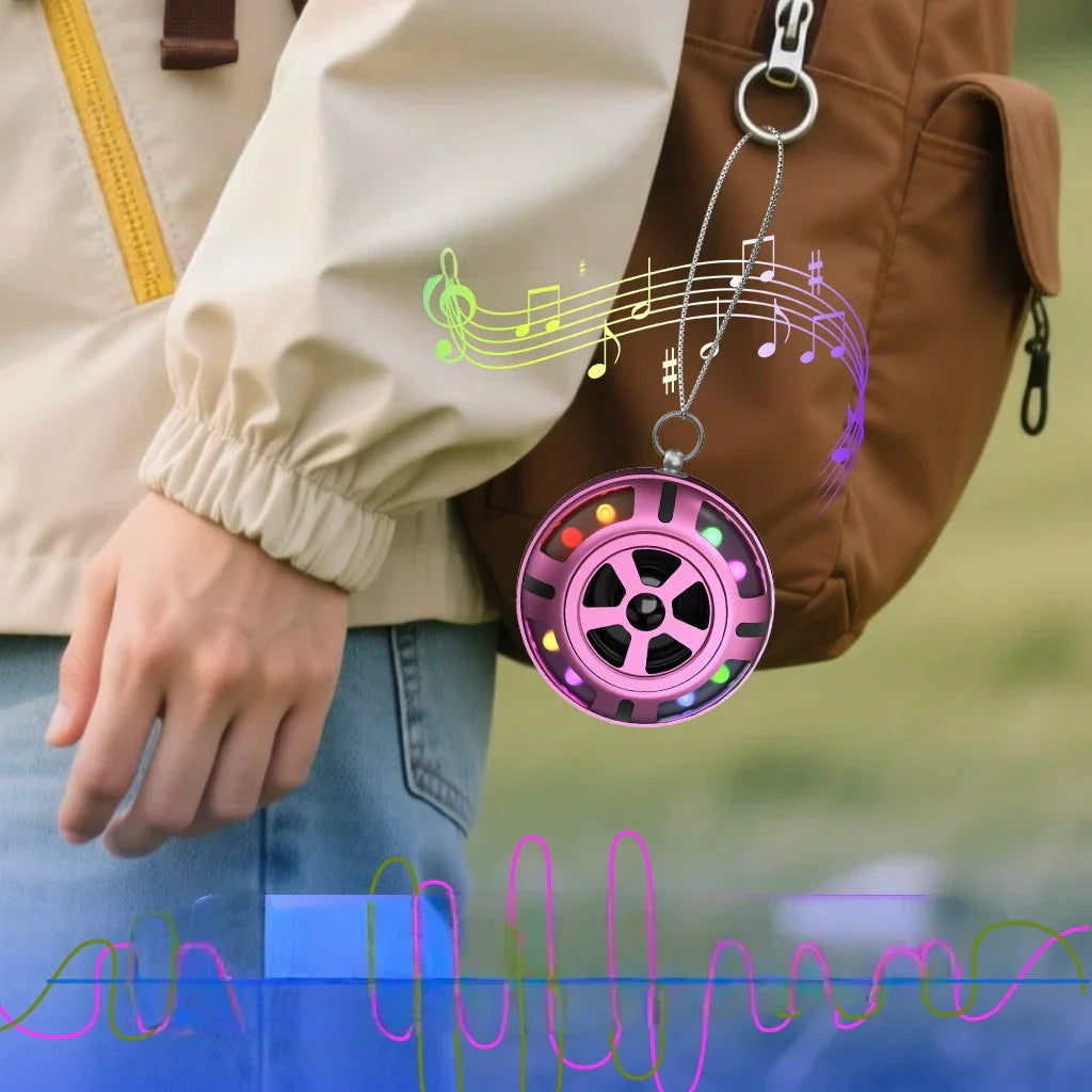 Pink tweeter car speaker with colorful led lights and wheel-like design hanging from chain for super power audio use