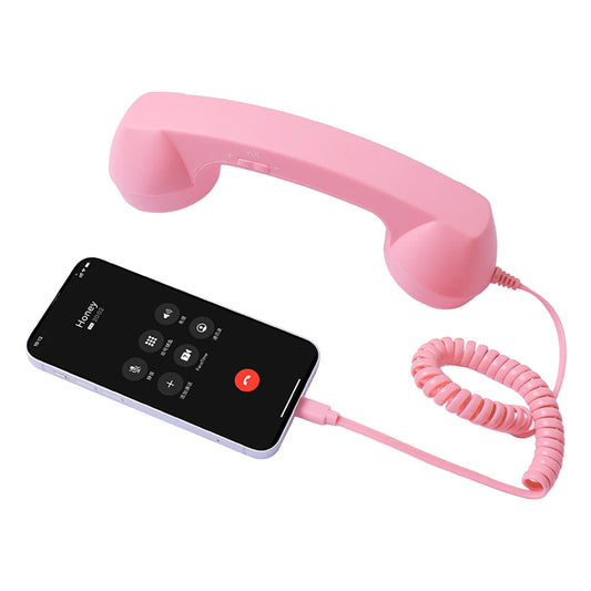 Pink plastic wired headset handset with coiled cable connected to smartphone for clear voice chat and live streaming