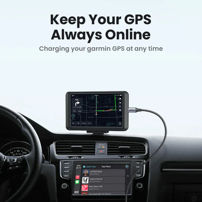 Black garmin gps device mounted on a dashboard with ugreen mini usb fast data charger cable connected for car dvr gps use
