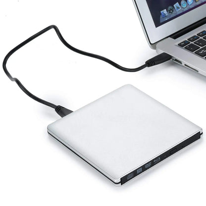 Silver blu-ray drive with sleek minimalist design and black cable connected to laptop for dvd+r and 4k blu ray playback