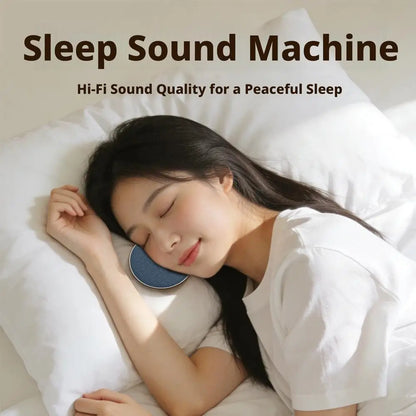 Blue circular wireless mini bedside pillow speaker with surround sound bone conduction resting against woman’s cheek