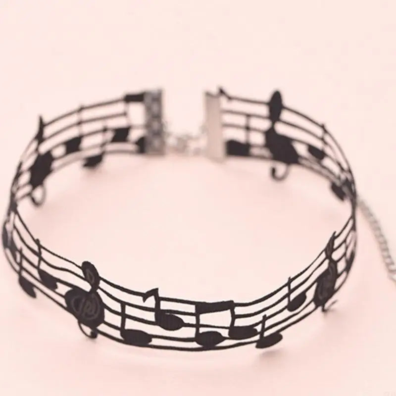 Black short necklace featuring a musical notes design with silver-toned clasp alloy theme neck jewelry for music enthusiasts