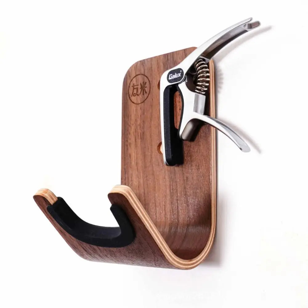 A sleek unique design wooden bracket guitar hanger mount bass storage in brown with black rubberized grip and metal tuner clip