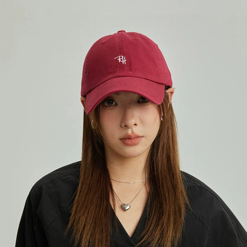 A maroon unisex rh letter embroidery baseball cap with white logo perfect for summer casual hat outdoor shade adjustable use