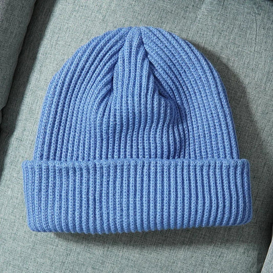 A soft light blue warm knitted beanie made of wool with a folded cuff ideal as female wool gorras or hip hop dad cap