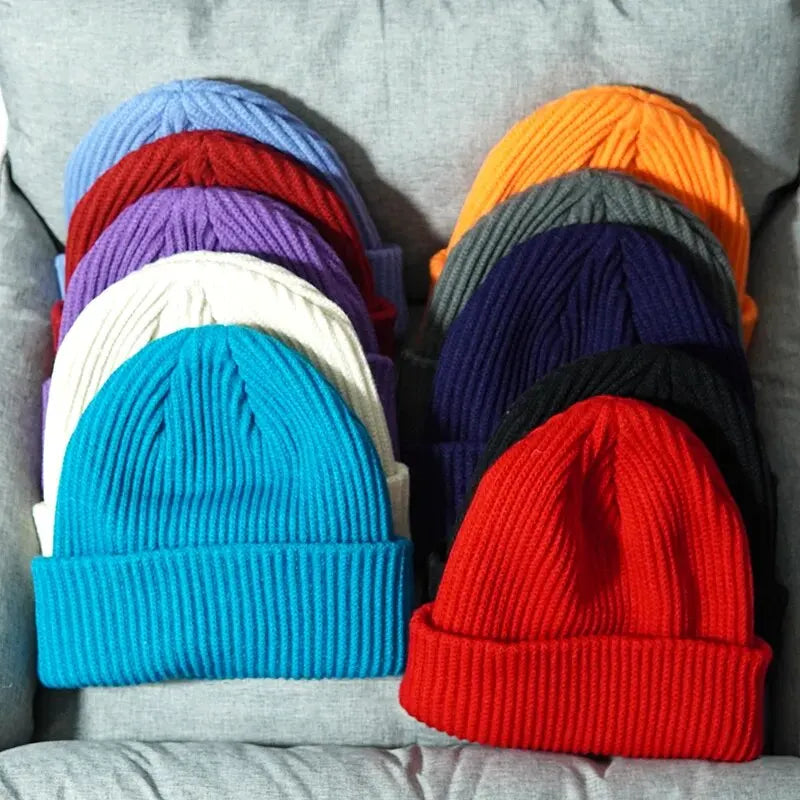 A vibrant red ribbed warm knitted beanie with a folded cuff perfect for female wool gorras and hip hop dad styles