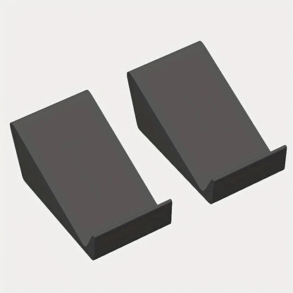 Two matte black rectangular universal adjustable soundbar stands with angled surfaces for home theater and desktop use