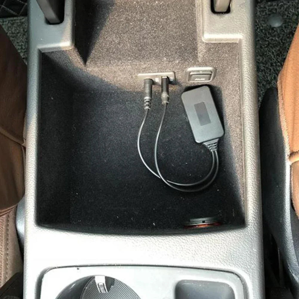 Gray rectangular universal bluetooth radio cable adapter with black cables and metallic connectors for car aux bluetooth