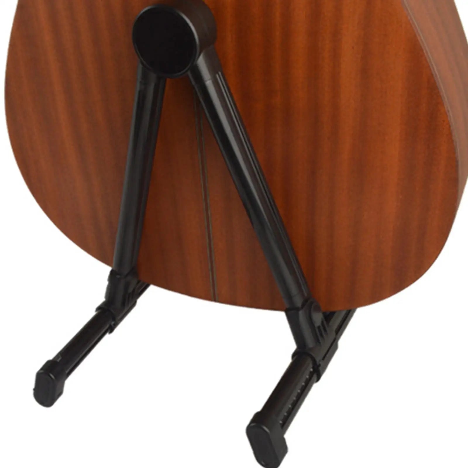 Black plastic universal electric guitar folding instrument stand supporting a wooden acoustic guitar