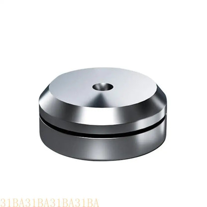 Shiny silver metallic cylindrical universal speaker isolation foot pad with central hole and concentric ridges for shockproof use