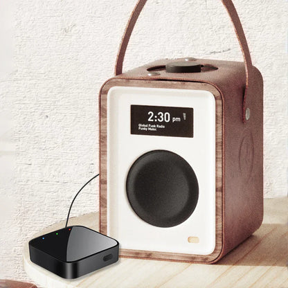 Brown leather-handled portable speaker with white front panel and wooden trim featuring upgraded bluetooth audio receiver transmitter music wireless adapter