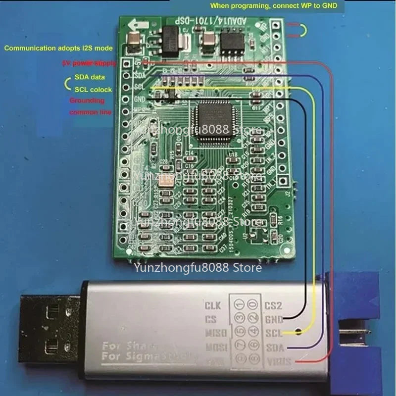 Silver usb-to-isp programmer with labeled pinout for connecting to green circuit board in dspmini learning board for music experience adau1401 upgrades