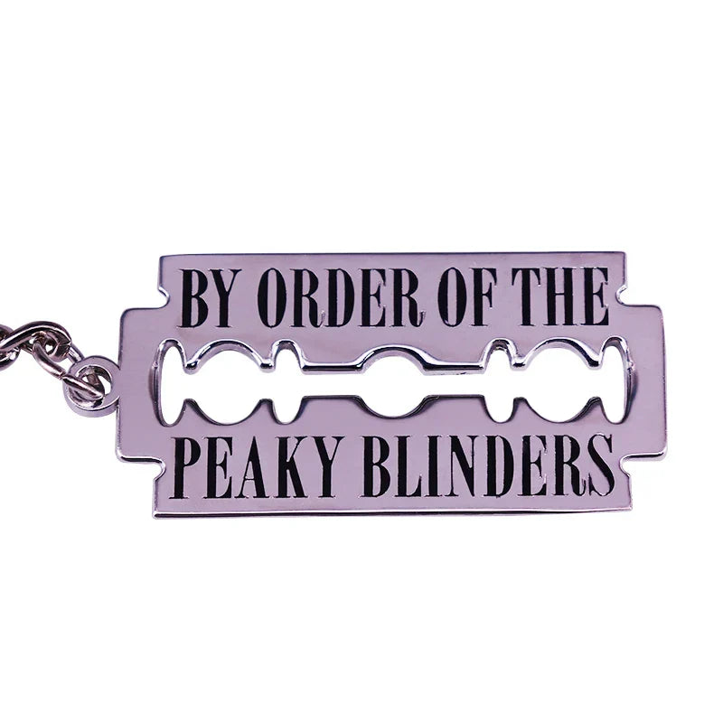 Silver metal street gang razor keychain peaky blinders with black engraved text for crime drama television fans