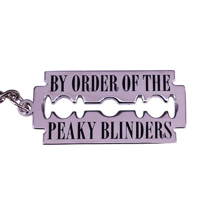 Silver metal street gang razor keychain peaky blinders with black engraved text for crime drama television fans