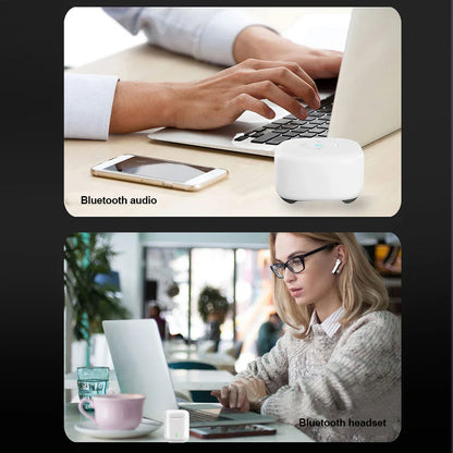 White compact bluetooth speaker with rounded edges paired with dongle wireless usb adapter transmitter receiver for keyboard speaker music