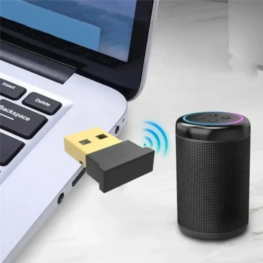 Black cylindrical smart speaker with mesh grille and colorful led ring used as a speaker audio receiver transmitter with usb bluetooth adapter