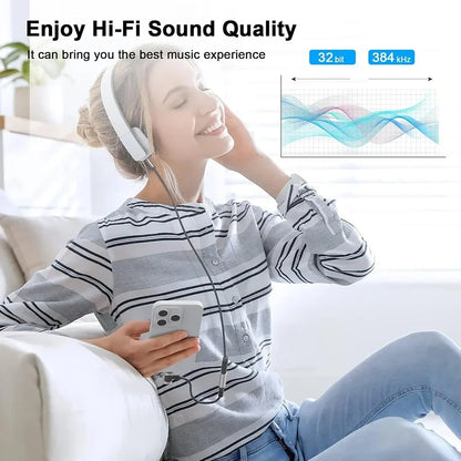 White over-ear headphones with black jack aux audio cable connected to a usb c audio adapter for iphone and samsung