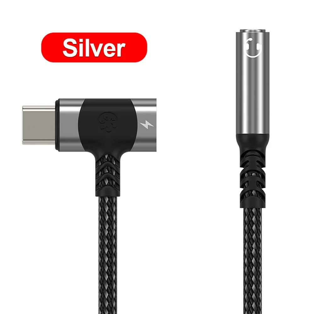 Silver usb c to 3.5mm jack aux audio adapter with black braided headphone cable and angled connector design