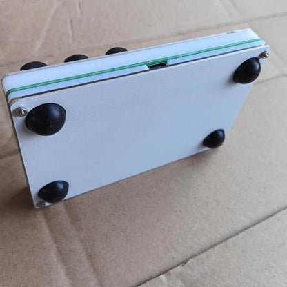 White rectangular midi fader controller with green edge and black rubber feet for custom cc mapping in type beat music