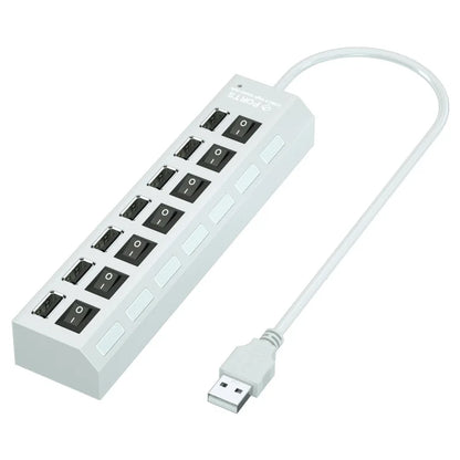 White plastic usb hub with multiple black power outlets and switches, a multi usb splitter power adapter for laptop macbook accessories