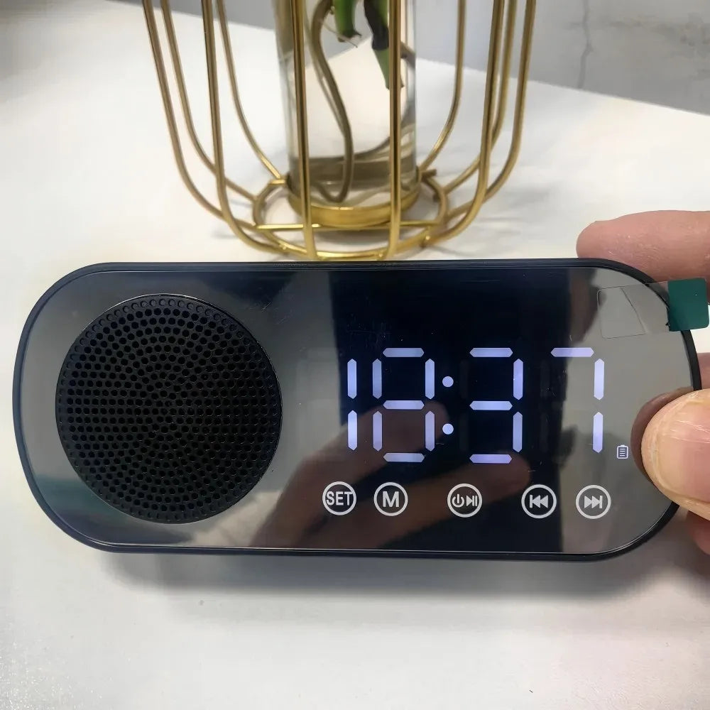 Black mirror digital alarm clock with curved design and blue led display featuring wireless speaker subwoofer and desktop music player
