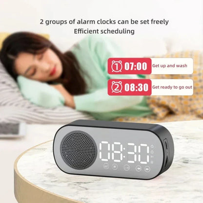 Black mirror digital alarm clock with led display showing 08 30 featuring wireless speaker subwoofer and desktop music player