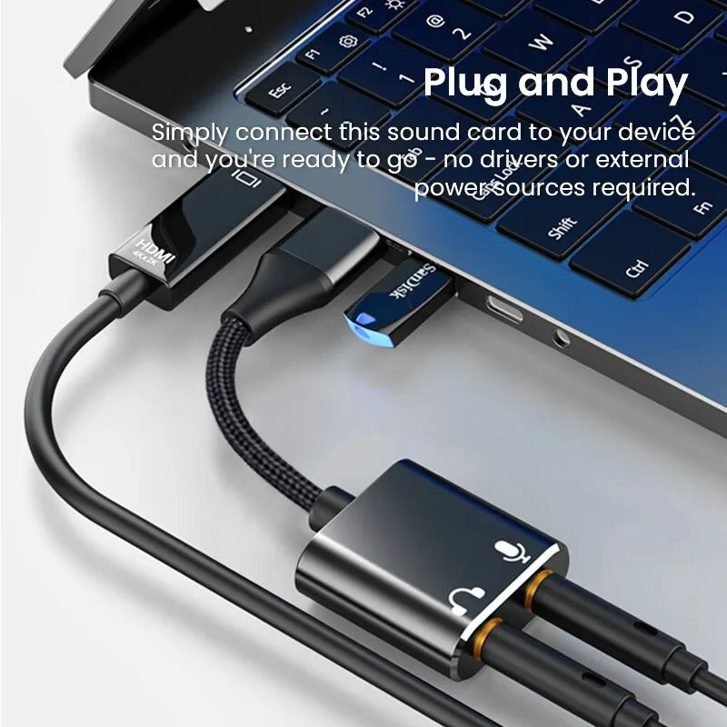 Black usb audio adapter with gold accents and braided cable featuring 3.5mm headphone and microphone jack for laptops