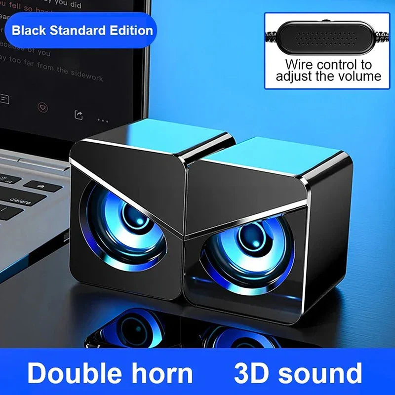 Black cube-shaped usb wired computer speakers with glowing blue surround sound led and gaming bass wired control