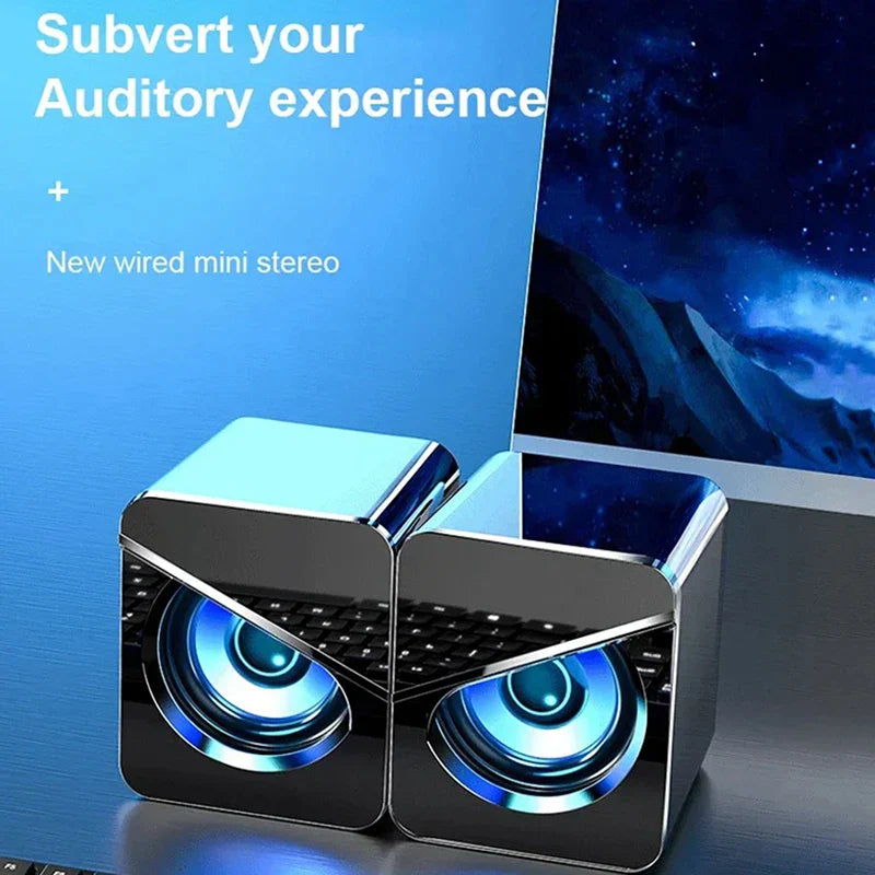 Black and silver cube-shaped usb wired computer speakers 4d shocking with glowing blue drivers and surround sound led for gaming bass wired use