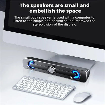 Black rectangular usb wired powerful computer speaker bar with blue illuminated drivers and silver rotary knob for surround sound box