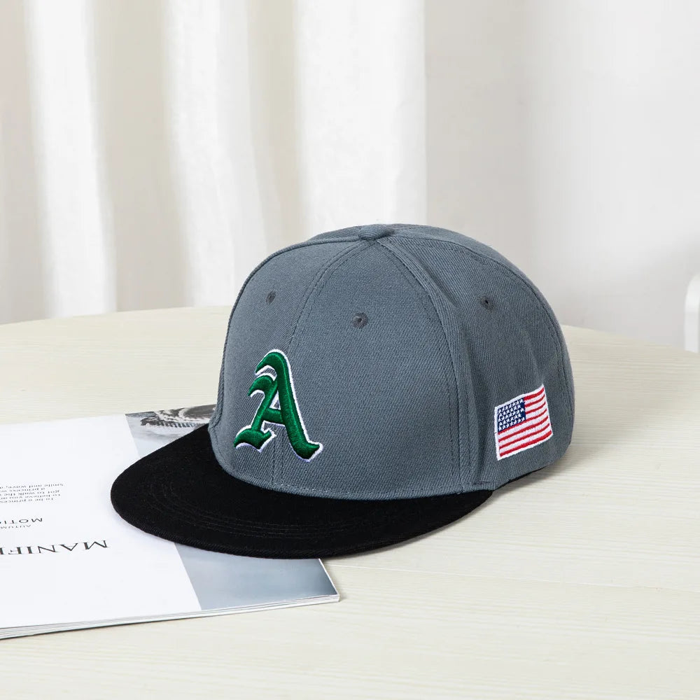 Hip-hop style baseball cap with a flat top, color patching, letter embroidery. Suitable for both women and men